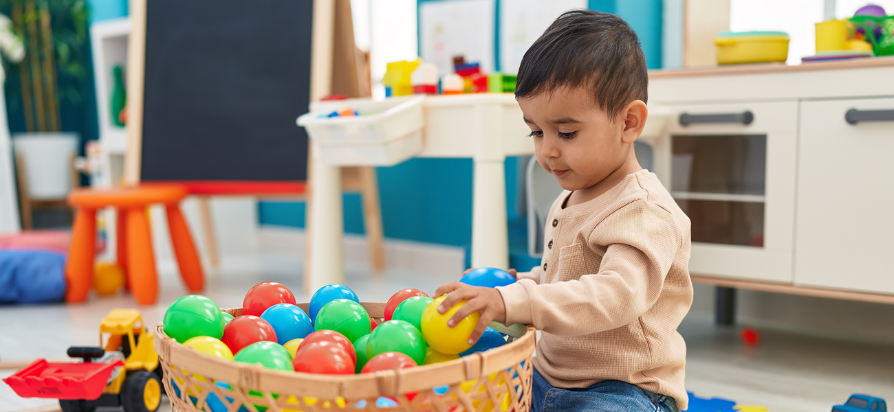 child playing with balls