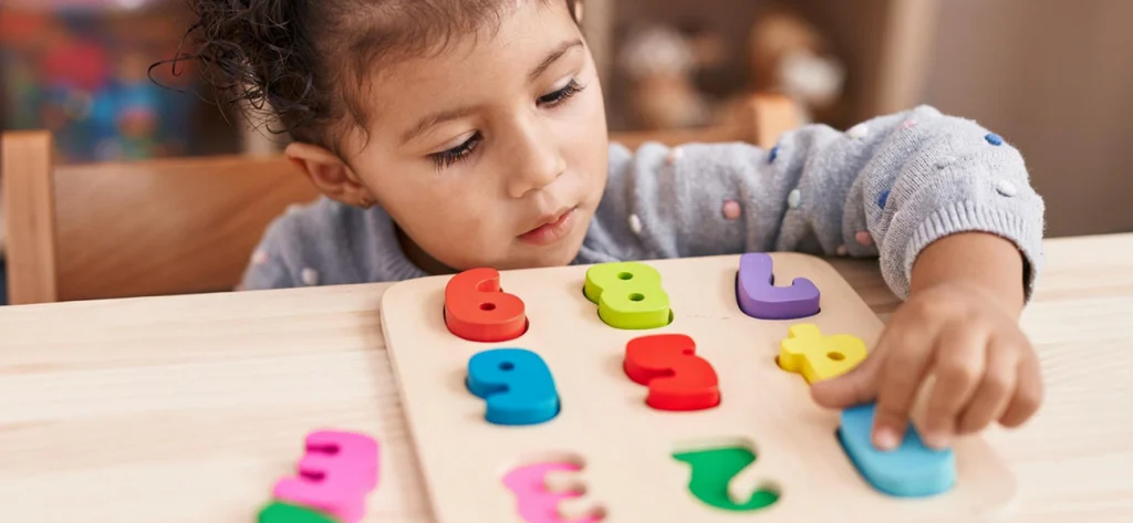 child playing with numbers